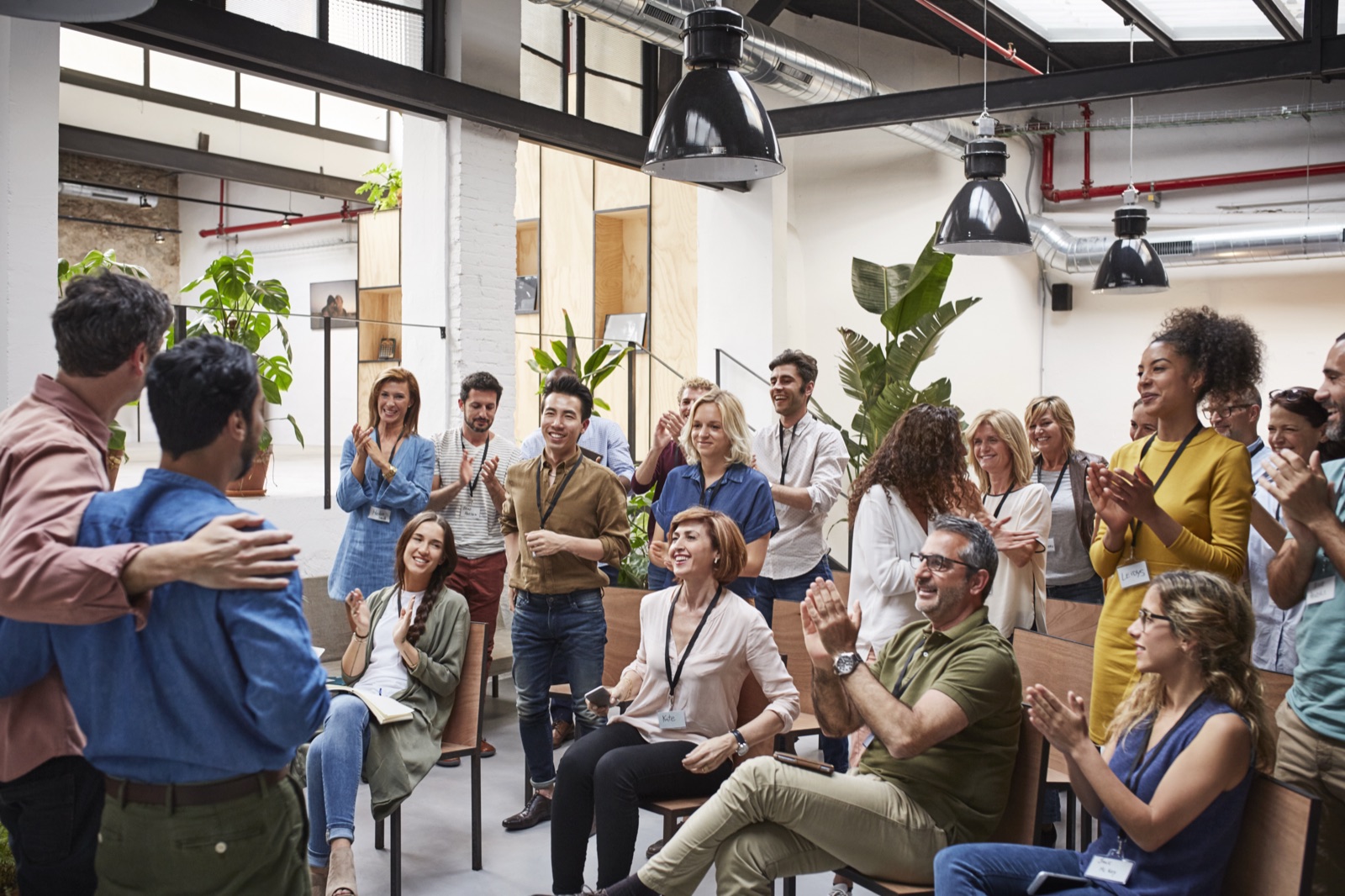 The Business Lions community applauding at a session