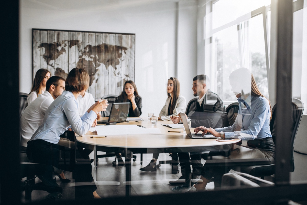 Founders gathered around a table at an early-morning circle