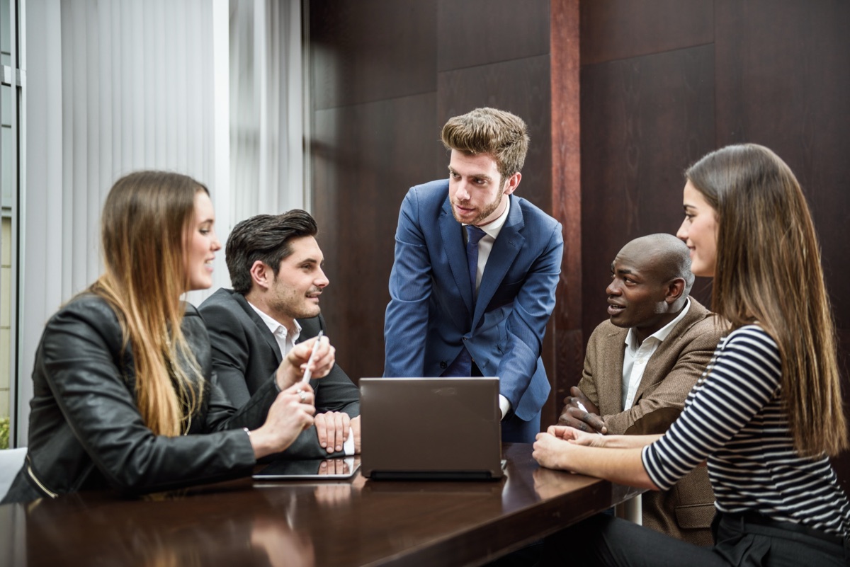 Group working through a plan together at a table